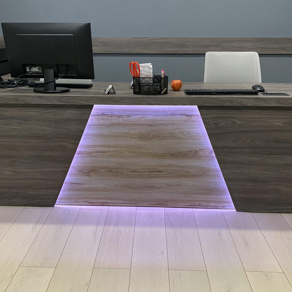 custom millwork desk with neon light